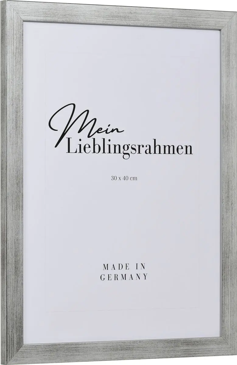 Seitenansicht eines silbernen Bilderrahmens mit sichtbarer Holzstruktur, glatter Oberfläche und kantigem, schlichtem Profil