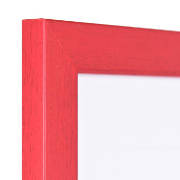 Holz-Profil Top Pro, rot - Ecke Ansicht der Ecke eines roten Bilderrahmens mit sichtbarer Holzstruktur, glatter Oberfläche und kantigem, schlichtem Profil